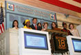 Mrs. Laura Bush raises the gavel signaling the close of trading Monday, Sept. 18, 2006, at the New York Stock Exchange. Mrs. Bush visited the Exchange to highlight literacy's role in extending benefits of free enterprise to individuals around the world.