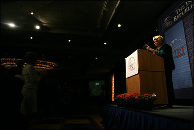 Mrs. Laura Bush applauds Ellen Johnson Sirleaf, President of Liberia, during the International Republican Institute's 2006 Freedom Award dinner Thursday, September 21, 2006, in Washington, D.C. IRI conducts a wide range of international programs to promote and strengthen democratic ideals and institutions. Mrs. Bush and President Sirleaf were presented the 2006 Freedom Award during the dinner.