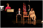 Mrs. Laura Bush, joined by President Michael Kaiser of the John F. Kennedy Center for the Performing Arts, and Mrs. Sehba Musharraf, wife of Pakistan's President Pervez Musharraf, delivers remarks during a presentation for the launching of a new Pakistani arts and cultural website Thursday, September 21, 2006, at The Kennedy Center in Washington, D.C. The website is created by the Pakistan National Council the Arts and The Kennedy Center and is called, "Gift of the Indus: The Arts and Culture of Pakistan."