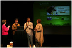 Watching the launch of a new Pakistani cultural and arts website, Mrs. Laura Bush stands with student Shaan Mihza of Eleanor Roosevelt High School, left; student Timothy Brown of Chantilly High School, and Mrs.Sehba Musharraf, wife of Pakistan's President Pervez Musharraf, Thursday, Sept. 21, 2006, at The John F. Kennedy Center for the Performing Arts in Washington, D.C. The website is created by the Pakistan National Council the Arts and The Kennedy Center and is called, "Gift of the Indus: The Arts and Culture of Pakistan."