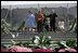 Mrs. Laura Bush joined by, left, Leone Reeder, Chair, National Fund for the U.S. Botanic Garden, and, right, Jim Hagedorn, Co-Chair, Board of Trustees, National Fund for the U.S. Botanic Garden, while the Ceremonial Garland is cut Friday, September 29, 2006, during a ceremony to celebrate the completion of the National Garden at the United States Botanic Garden in Washington, D.C. This new facility, located on a three-acre site just west of the Conservatory, will be a showcase for unusual, useful, and ornamental plants that grow well in the mid-Atlantic region.