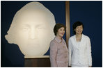 Mrs. Laura Bush and Mrs. Akie Abe, wife of Japanese Prime Minister Shinzo Abe, stand before a portrait of George Washington as they talk to members of the media, following a tour of the Mount Vernon Estate of George Washington Thursday, April 26, 2007, in Mount Vernon, Va.