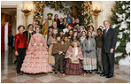 President George W. Bush and Mrs. Laura Bush pose for a photo with the Ford Theater cast members of "A Christmas Carol," following their performance Monday, Dec. 3, 2007, at the White House Children's Holiday Reception.