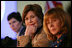 Mrs. Laura Bush listens to panel members during her participation is a roundtable discussion on the special needs of military youth and families Wednesday, Dec. 5, 2007, at the Learning Center at Andrews Air Force Base in Maryland.