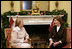 Mrs. Laura Bush enjoys a visit Tuesday morning, Dec. 11, 2007, with Mrs. Clio Napolitano, wife of President Giorgio Napolitano of Italy, during their visit to the White House.