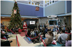 Mrs. Laura Bush reads "Rudolph the Red Nosed Reindeer" to children at the Children's National Medical Center in Washington, D.C., Wednesday, Dec. 12, 2007, following a tour of the Surgical Care Unit where she visted with young patients.