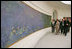 Mrs. Laura Bush tours the Musee de l'Orangerie with Director Pierre Georgel, right, and US Ambassador Craig Stapleton and his wife Mrs. Stapleton, left, in Paris Monday, Jan. 15, 2007. The Musee de l'Orangerie is home to eight paintings from Monet's large-format series of Water Lilies.