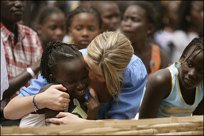 Ms. Jenna Bush hugs a little girl who danced during a performance Tuesday, June 26, 2007, by musician Youssou N'Dour for the children at Grand Medine Primary School in Dakar, Senegal.