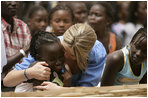 Ms. Jenna Bush hugs a little girl who danced during a performance Tuesday, June 26, 2007, by musician Youssou N'Dour for the children at Grand Medine Primary School in Dakar, Senegal.