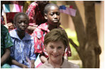 Mrs. Laura Bush visits with students and teachers at the Nelson Mandela Primary School Complex Friday, June 29, 2007, in Bamako, Mali. The United States is partnering with African nations in the Africa Education Initiative, a $600 million dollar investment that will provide 550,000 scholarships to African children and train more than 900,000 teachers by 2010.