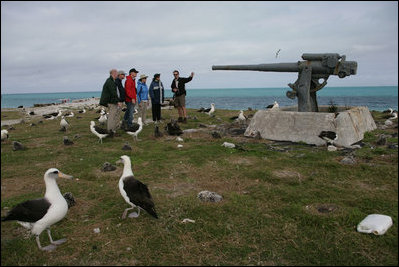 Mrs. Laura Bush views albatross birds and remnants of World War II with wildlife biologist John Klavitter during a tour of Eastern Island on Midway Atoll, part of the Northwest Hawaiian Islands National Monument, Thursday, March 1, 2007. Midway Atoll was the site of the Battle of Midway June 4, 1942. The U.S. Navy defeated a Japanese attack against Midway Islands, marking a turning point in the war in the pacific theater.