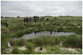 Mrs. Laura Bush tours Eastern Island Monument Seep wetlands Thursday, March 1, 2007, where several endangered Laysan ducks were brought it in 2004. A freshwater pond was dug and native grasses were restored to create breeding grounds for the ducks.