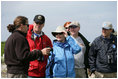 Mrs. Laura Bush talks with wildlife biologist, John Klavitter, left, Interior Secretary Interior Dirk Kempthorne and Chairman Jim Connaughton of the Council on Environmental Quality at the Midway Atoll National Wildlife Refuge Thursday, March 1, 2007. The island is home to a great number of endangered species such as Laysan Ducks, Short-tailed Albatross, Hawaiian Monk Seals and Hawaiian Green Sea Turtles.