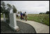 Mrs. Laura Bush visits the Battle of Midway Memorial on the parade grounds of Midway Island Thursday, March 1, 2007. Midway Atoll was the site of the World War II battle June 4, 1942. The U.S. Navy defeated a Japanese attack against Midway Islands, marking a turning point in the war in the pacific theater. Interior Secretary Dirk Kempthorne is pictured wearing a blue shirt and is standing next to Mrs. Bush.