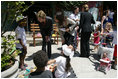 Mrs. Laura Bush talks with a little boy at Projecto Aprendiz Friday, March 9, 2007, in Sao Paulo, Brazil.