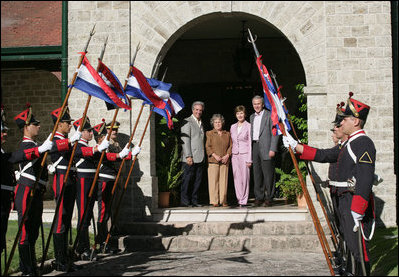 President George W. Bush and Mrs. Laura Bush meet President Tabare Vazquez of Uruguay and his wife, Maria Auxiliadora Delgado de Vazquez at the Main House, Estancia Anchorena, in Colonia, Uruguay, Saturday, March 10, 2007.