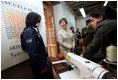 Mrs. Laura Bush tours Escuela de Artes y Oficios with Mrs. Lina Moreno De Uribe, wife of President Uribe of Colombia. Bogota, Colombia, Sunday, March 11, 2007. Mrs. Bush talks to an artist during the tour.