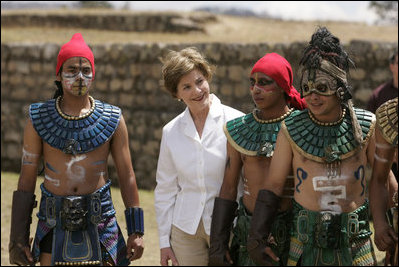 Mrs. Laura Bush poses with performers Monday, March 12, 2007, after a demonstration of a Mayan Ritual competition in Iximche, Guatemala. President and Mrs. Bush visited three Guatemalan villages during the morning hours before departing for Mexico, the last stop of their five-country, Latin American visit.