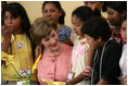 Mrs. Laura Bush talks to children at Camino Seguro (Safe Passage) in Guatemala City, Guatemala, Monday, March 12, 2007.