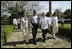 President George W. Bush and Mrs. Laura Bush walk with Mexico's President Felipe Calderon and Mrs. Margarita Zavala upon their arrival Tuesday, March 13, 2007, to Hacienda Temozon in Temozon Sur, Mexico.