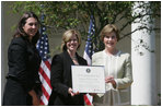 Mrs. Laura Bush presents a plaque to Abbe Raven, center, president and CEO of A&E Television Networks, and Nancy Dubuc, president of The History Channel, honoring them with a 2007 Preserve America Presidential Award in the Rose Garden at the White House Wednesday, May 9, 2007, honored for the establishment of the Save Our History grant program for historic preservation, and promotion of the historic hertiage of America.