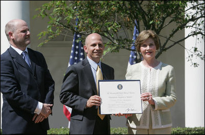 Mrs. Laura Bush presents a plaque to Craig Heller, center, president of Loftworks and John Steffen, left, president of Pyramid Construction, honoring them with a 2007 Preserve America Presidential Award in the Rose Garden at the White House Wednesday, May 9, 2007. The Steffen and Heller companies were honored for their work in preserving and revitalizing the historic downtown of St. Louis, Mo.