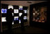 Mrs. Laura Bush, joined by Russell Caldwell, manager of visitor services at the Margaret Mitchell House and Museum in Atlanta, Ga., looks at a photo display showing images from the 1939 movie premiere of Gone with the Wind, during a tour of the famous author's home, Thursday, Nov. 1, 2007.