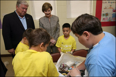 Mrs. Laura Bush visits with Taconi Elementary fifth graders Friday, Nov. 2, 2007, in Ocean Springs, Miss., prior to delivering remarks during the announcement of the Coastal Ecosystem Learning Center Designation and Marine Debris Initiative. The Marine Debris Initiative focuses on identifying, reducing and preventing debris in the marine environment through public and private partnerships, education and international cooperation.