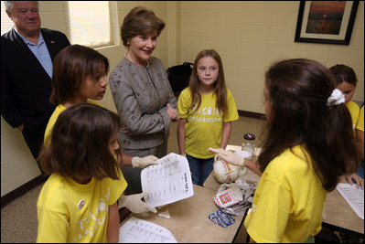 Mrs. Laura Bush visits with Taconi Elementary fifth graders Friday, Nov. 2, 2007, in Ocean Springs, Miss., prior to delivering remarks during the announcement of the Coastal Ecosystem Learning Center Designation and Marine Debris Initiative. The students worked with Gulf Coast Research Laboratory graduate students from the University of Southern Mississippi to learn the importance of prevention, reducing, and removal of ocean and coastal debris. 