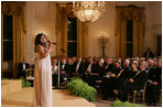 President George W. Bush, Mrs. Laura Bush and guests listen to singer Melinda Doolittle perform Tuesday evening, Nov. 13, 2007 in the East Room of the White House, during a social dinner in honor of America's Promise-The Alliance for Youth. 