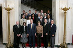 President George W. Bush and Mrs. Laura Bush stand with the crew members of the Space Shuttle Discovery (STS-116), Space Shuttle Atlantis (STS-117), Space Shuttle Endeavour (STS-118), and International Space Station Expeditions 14 and 15, Wednesday, Nov. 14, 2007 in the Grand Foyer of the White House. Since December 2006, NASA astronauts have journeyed more than 15 million miles in space and conducted more than a dozen space walks.