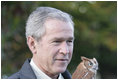 President George W. Bush holds a screech owl Saturday, Oct. 20, 2007 at the Patuxent Research Refuge in Laurel, Md., where President Bush discussed steps his Administration is creating for a series of cooperative conservation steps to preserve and restore critical stopover habitat for migratory birds in the United States.