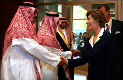 Mrs. Laura Bush is greeted by Mr. Bade Al-Romaih, Guest Relations Manager for the Conference Palace Hotel, upon her arrival for a private lunch Tuesday, Oct. 23, 2007, in Riyadh, Saudi Arabia.