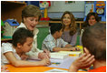 Mrs. Laura Bush helps Balkes Nafe put together a puzzle during a visit with young patients in the Children's Playroom at the King Hussein Cancer Center Thursday, Oct. 25, 2007, in Amman, Jordan. Also pictured are Her Royal Highness Princess Ghida Talal, left, and Her Royal Highness Princess Dina Mired bin Ra'ad.