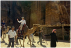 Mrs. Laura Bush takes a ride on a camel while touring Petra, an ancient city in southern Jordan Friday, Oct. 26, 2007. In 1997, a carved relief depicting two pairs of camels and camel drivers were discovered at the entrance of the city. During its time, Petra was a caravan city and trading center for the entire region.