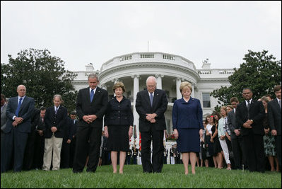 President George W. Bush, Mrs. Laura Bush, Vice President Dick Cheney and Mrs. Lynne Cheney bow their heads for a moment of silence on the South Lawn of the White House Tuesday, Sept. 11, 2007, in memory of those whose lives were lost on Sept. 11, 2001.