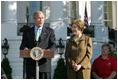 Standing with Mrs. Laura Bush, President George W. Bush addresses military support organizations Tuesday, Sept. 18, 2007, on the South Lawn. "I feel a very strong obligation, since it was my decision that committed young men and women into combat, to make sure our veterans who are coming back from Iraq and Afghanistan get all the help this government can possibly provide," said President Bush.