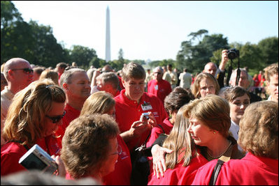 Mrs. Laura Bush hugs a woman during an event for military support organizations Tuesday, Sept. 18, 2007, on the South Lawn.