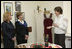 A volunteer briefs Mrs. Laura Bush and Mrs. Kateryna Yushchenko during their visit Tuesday, April 1, 2008, to the Ukraine Peace Corps headquarters in Kyiv. Mrs. Bush thanked all the volunteers for their service, telling them that during their 27 months of service, they serve as ambassadors for the United States, "sharing the best of our country with those who may never come into contact with another American."