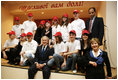 President George W. Bush and Mrs. Laura Bush pose with students from School 57 in Kyiv Tuesday, April 1, 2008, after the Ukrainian teens performed a skit sponsored by PEPFAR, the President's Emergency Plan for AIDS Relief.