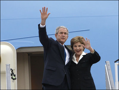 President George W. Bush and Mrs. Laura Bush wave upon their Romanian arrival Tuesday, April 1, 2008, at Henri Coanda International Airport in Bucharest, site of the 2008 NATO Summit.