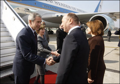 President George W. Bush and Mrs. Laura Bush are greeted upon arrival Wednesday, April 2, 2008, by President Traian Basescu of Romania and Mrs. Maria Basescu at Mihail Kogalniceanu Airport in Constanta, Romania.