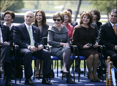 Mrs. Laura Bush and Mrs. Maria Basescu, spouse of Romania's President Traian Basescu, break out in laughter at remarks made Wednesday, April 2, 2008, during a joint press availability with their husbands at the Protocol Villas Neptun-Olimp in Neptun, Romania.