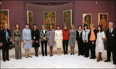 Mrs. Laura Bush poses for a photo with other NATO Spouses' during a visit to the National Art Museum Thursday, March 3, 2008, in Bucharest.