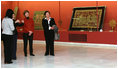 Mrs. Laura Bush listens to Ms. Roxana Theodorescu, Director of the National Art Museum, during a visit Thursday, April 3, 2008, in Bucharest.