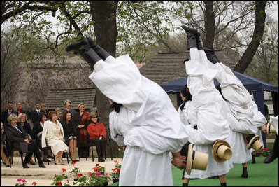 Mrs. Laura Bush joins the spouses of NATO leaders Thursday, April 3, 2008, for a traditional folk music program at Dimitrie Gusti Village Museum in Bucharest. Located just outside the city, the museum is laid out like a typical rural Romanian village and includes around 300 authentic rural buildings from every region of the country. 