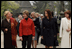 Mrs. Laura Bush walks with the spouses of NATO leaders Thursday, April 3, 2008, at the open-aired Dimitrie Gusti Village Museum in Bucharest. With her are Maria Basescu, right, spouse of Romania's President Traian Basescu, and Alexandra Coman, fiance of Romania's Foreign Minister Adrian Cioroianu. White House photo by Shealah Craighead