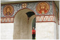 White House photo by Shealah Craighead Mrs. Laura Bush peers through an archway at the Dimitrie Gusti Village in Bucharest Thursday, April 3, 2008, as she joined fellow spouses of NATO leaders for a tour of the open-air museum.