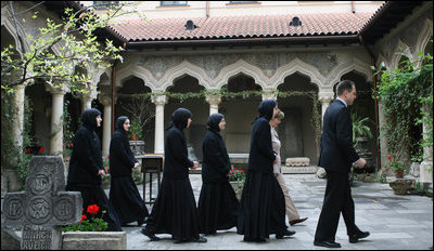 Mrs. Laura Bush and Sisters of the Stavropoleos Monastery in Bucharest, follow Dr. Petre Radu Guran as he leads them across the church courtyard Friday, April 4, 2008. In 2003, the U.S. Embassy donated $27,000 for the restoration of the courtyard under the auspices of a special U.S. Department of State program entitled, "Ambassador's Fund for Cultural Preservation."