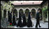 Mrs. Laura Bush and Sisters of the Stavropoleos Monastery in Bucharest, follow Dr. Petre Radu Guran as he leads them across the church courtyard Friday, April 4, 2008. In 2003, the U.S. Embassy donated $27,000 for the restoration of the courtyard under the auspices of a special U.S. Department of State program entitled, "Ambassador's Fund for Cultural Preservation."